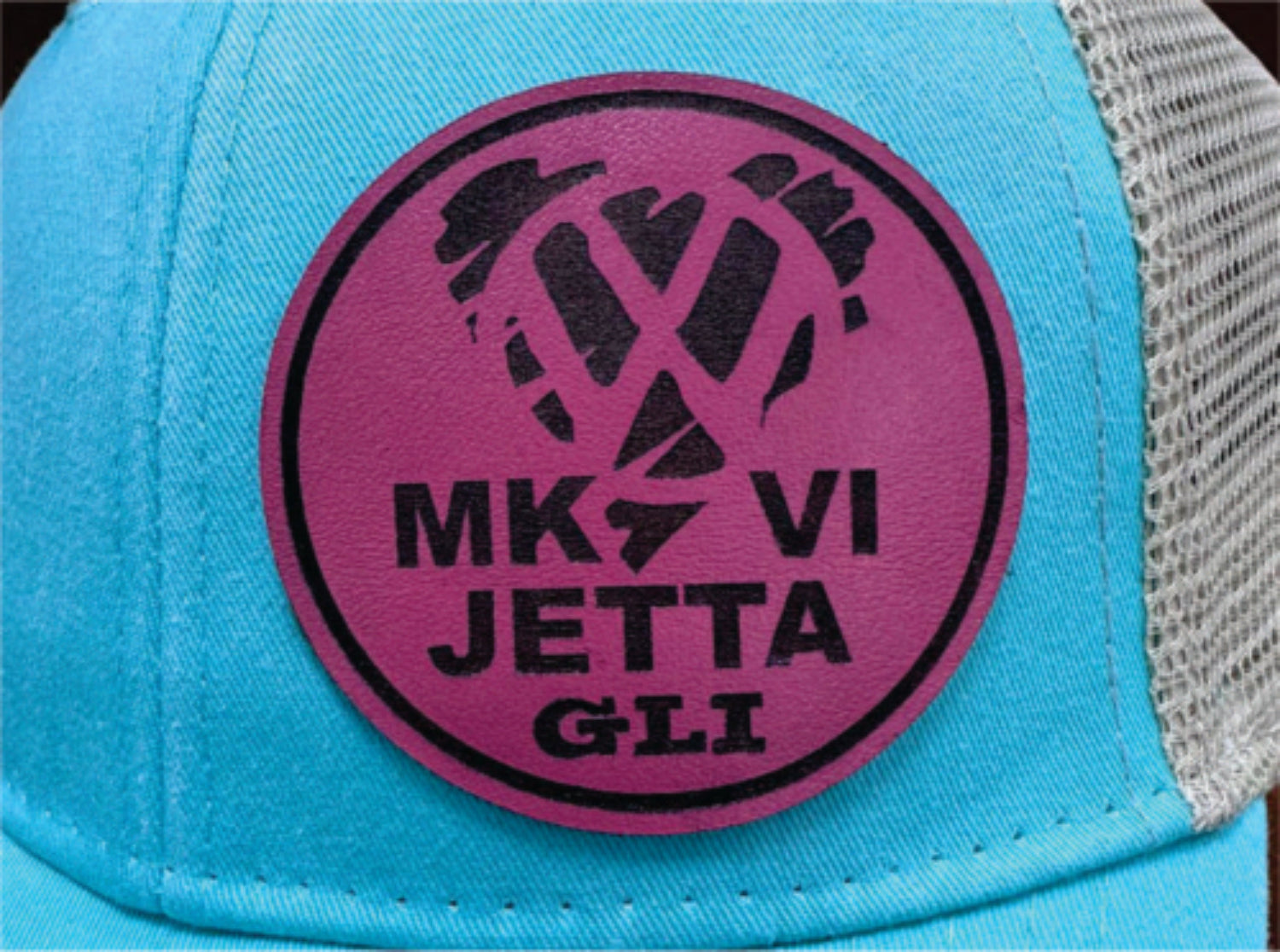Blue cap with a purple logo featuring 'MK VI Jetta GLI' text